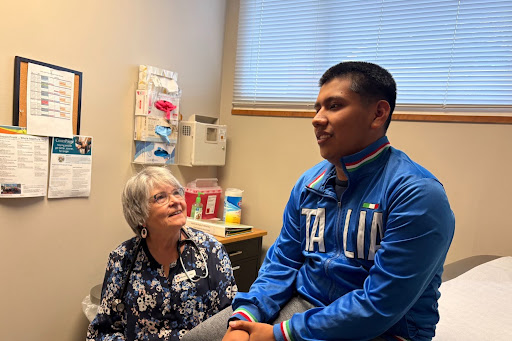 Young patient receiving free medical care at clinic